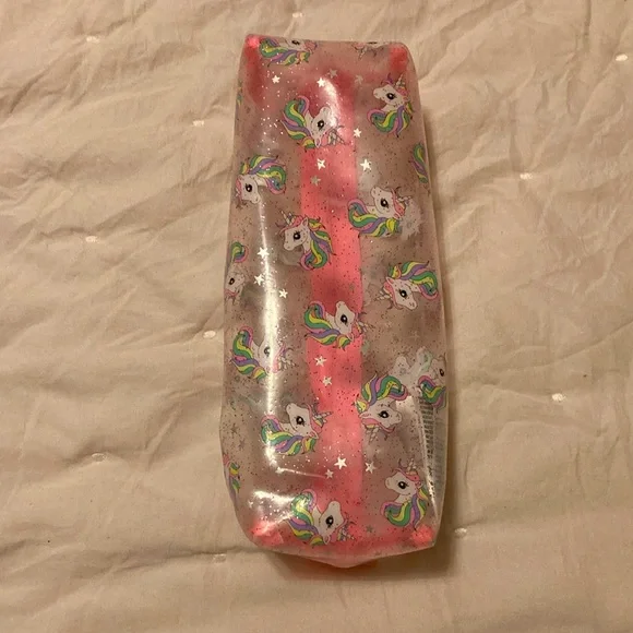 A pink, white, clear unicorn pouch. From: H&M. Name: Unicorn Pouch - Picture 4 of 5